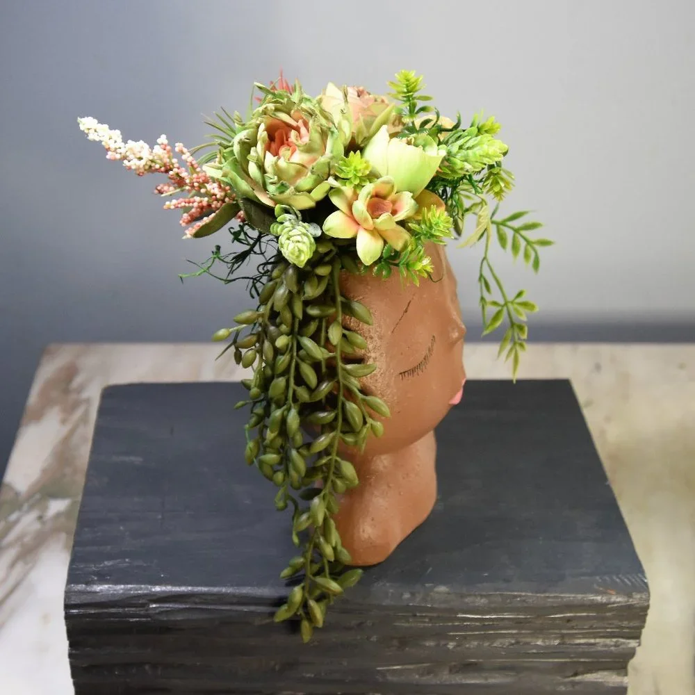 Serene, peaceful airbrushed Sola wood succulents in a fun fabulous face planter